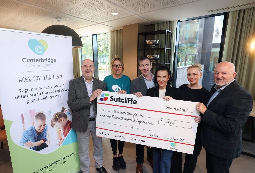 Sutcliffe cheque presentation with Clatterbridge Cancer Charity